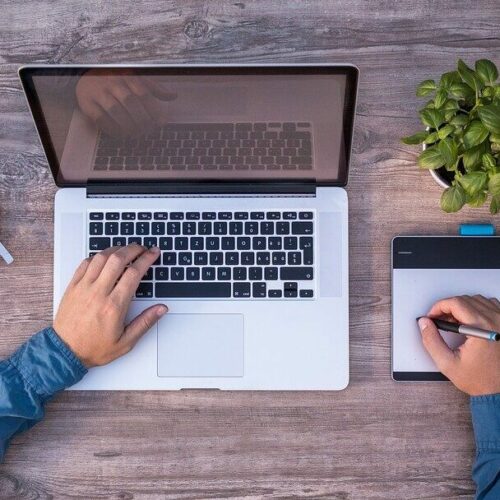 Content designer sits in front of laptop at work