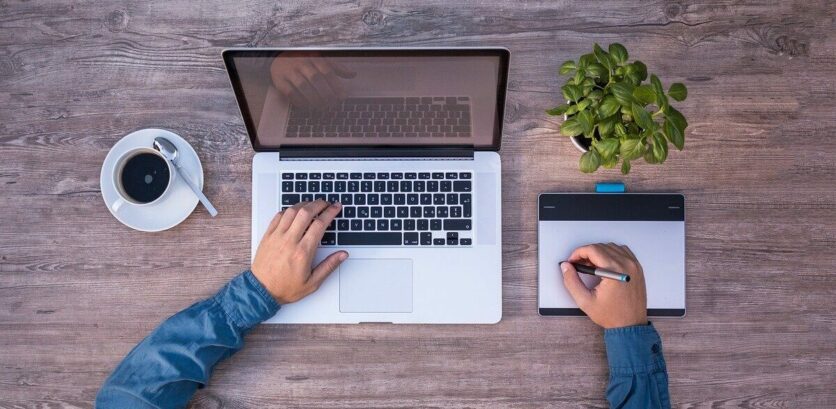 Content designer sits in front of laptop at work