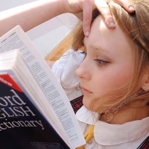 Girl reading the Oxford English Dictionary