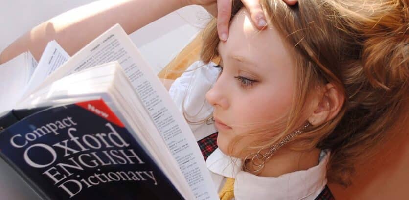 Girl reading the Oxford English Dictionary